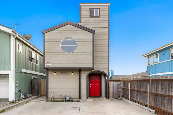 a front view of a house with garage