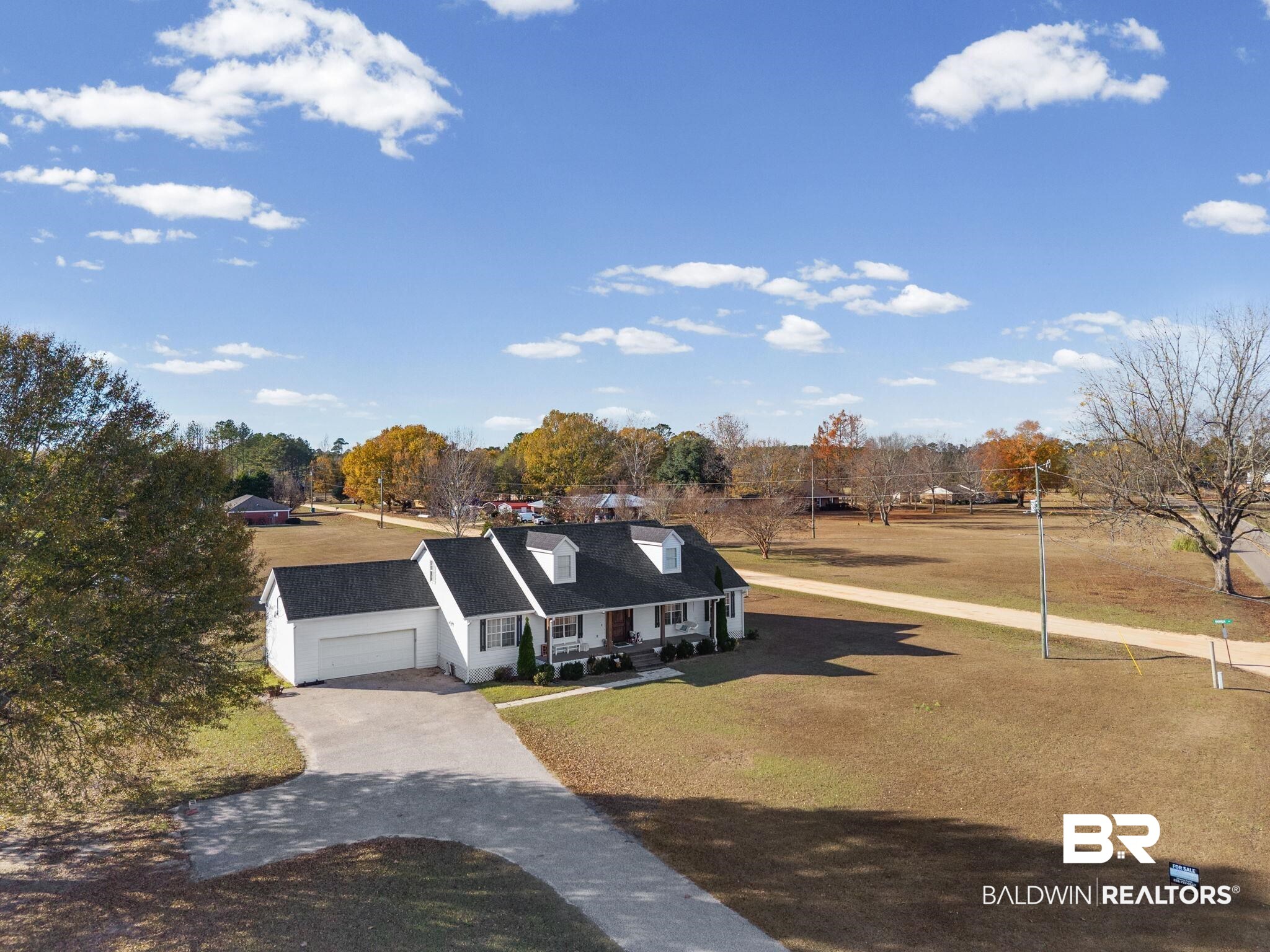 3842 Experiment Farm Road Monroeville, AL 36460 - Photo 56 of 59 View of front of property featuring driveway, a front yard, and a garage