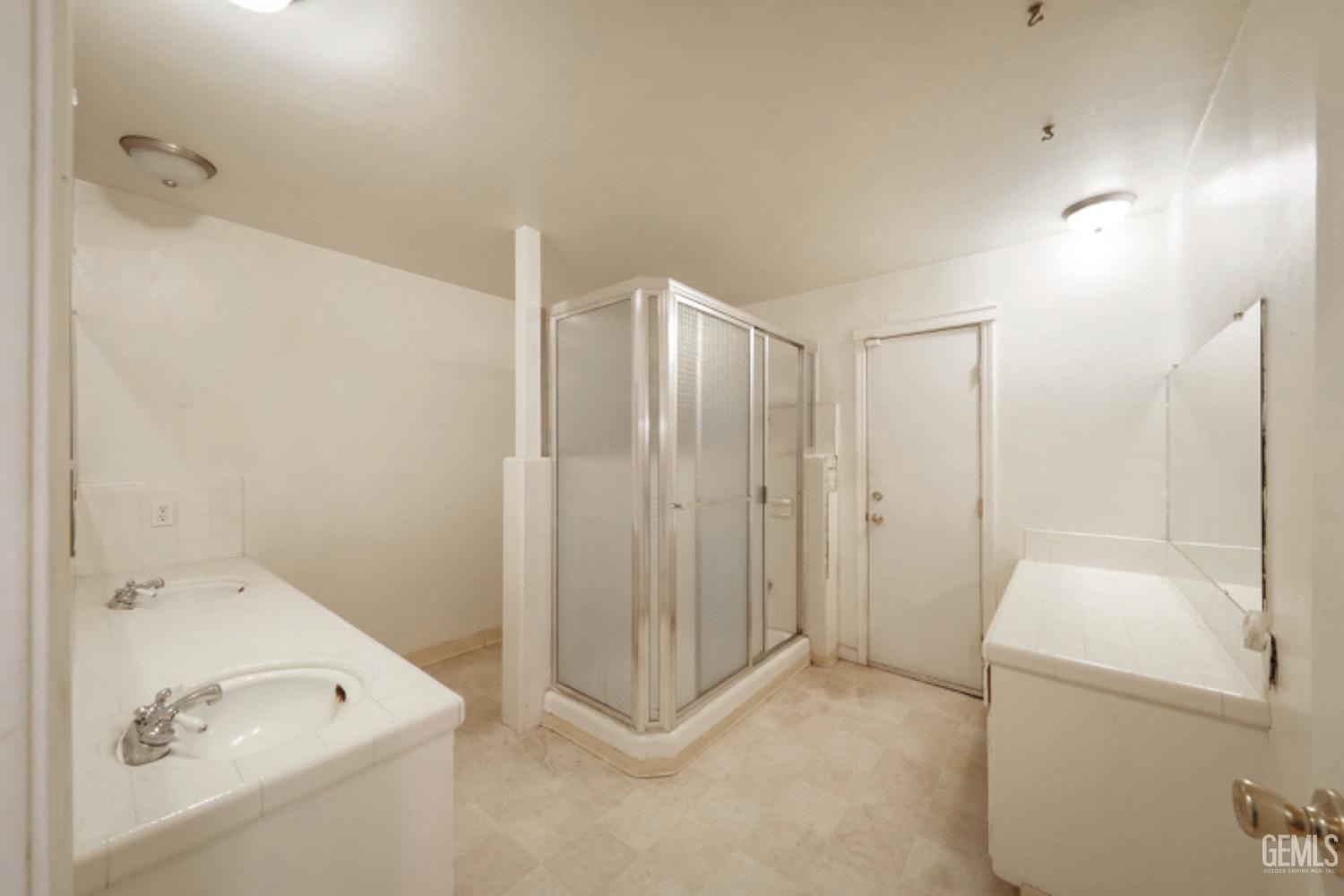 Undisclosed Address Bakersfield, CA 93306 - Photo 17 of 22 a bathroom with a tub a sink and a shower