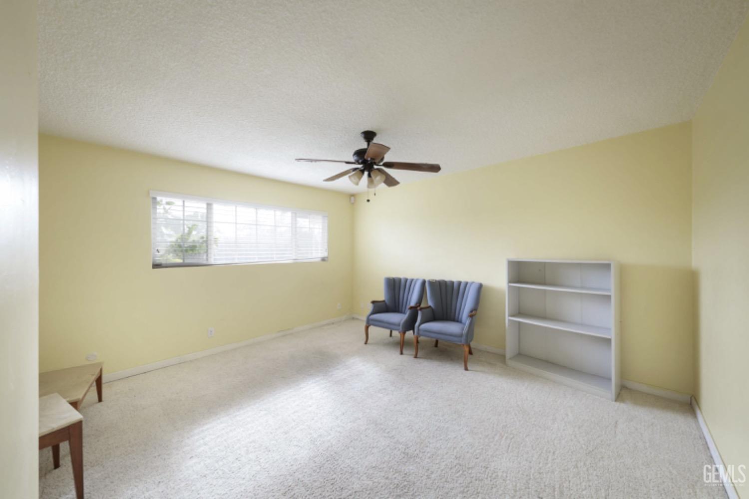 Undisclosed Address Bakersfield, CA 93306 - Photo 18 of 22 a view of a livingroom with furniture and a ceiling fan