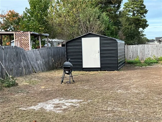 a view of deck and wooden fence
