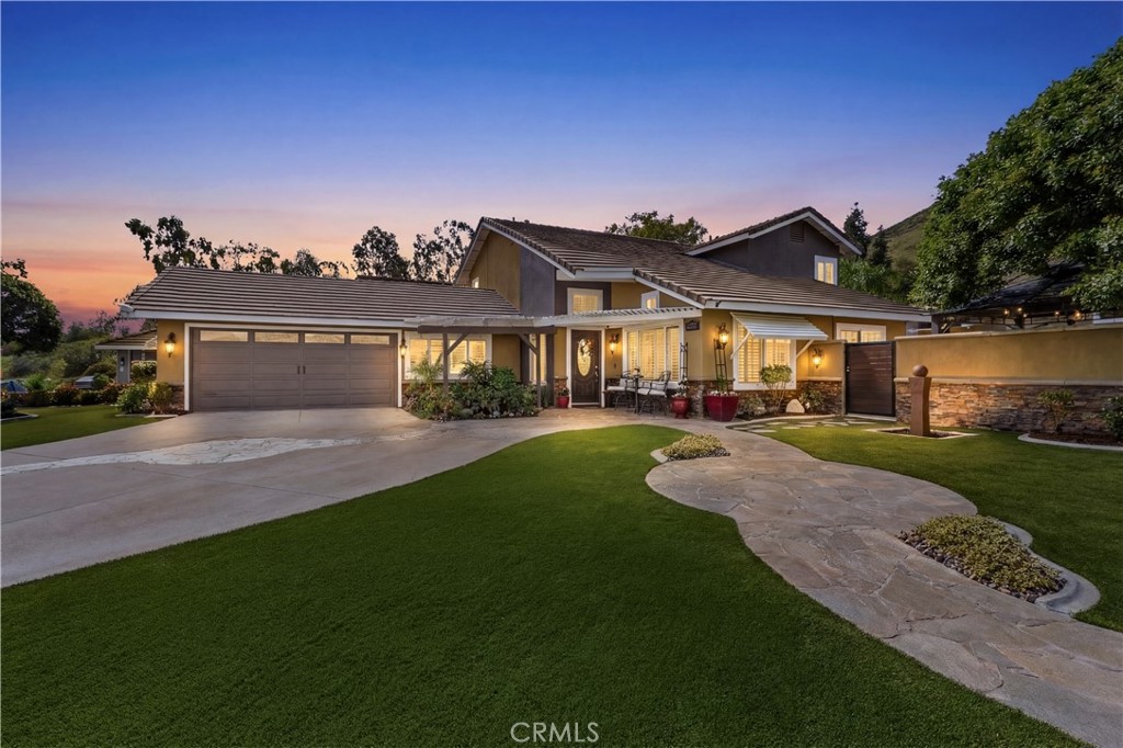 a front view of a house with a yard