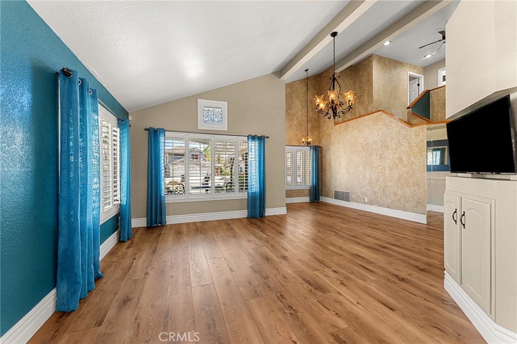 16825 Winterbrook Circle Riverside, CA 92503 - Photo 11 of 42 a view of a livingroom with wooden floor and a flat screen tv