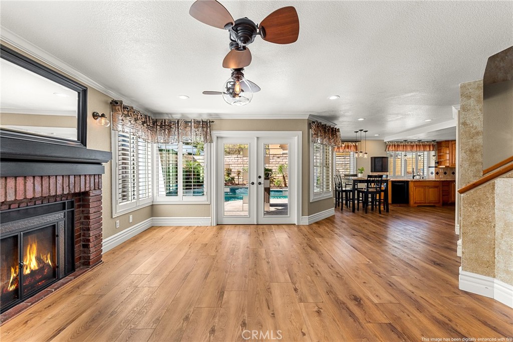 16825 Winterbrook Circle Riverside, CA 92503 - Photo 14 of 42 a view of an empty room with wooden floor fireplace and a window