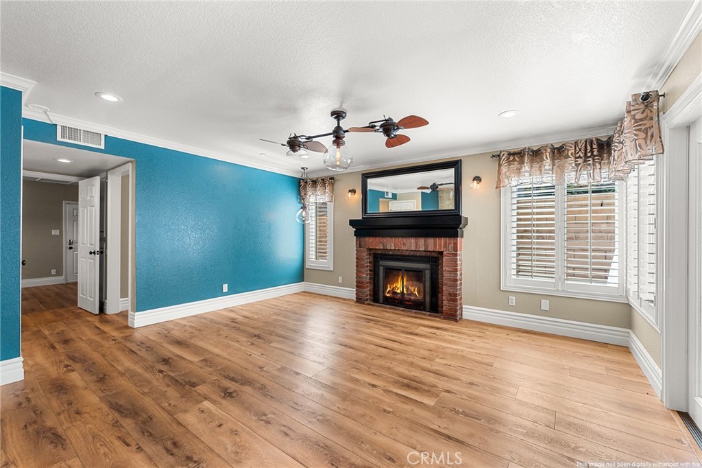 16825 Winterbrook Circle Riverside, CA 92503 - Photo 15 of 42 a view of an empty room with a fireplace and a window