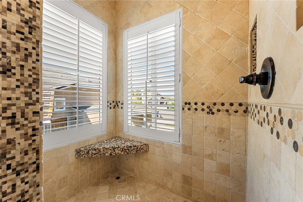 16825 Winterbrook Circle Riverside, CA 92503 - Photo 21 of 42 a bathroom with a granite countertop shower and a window