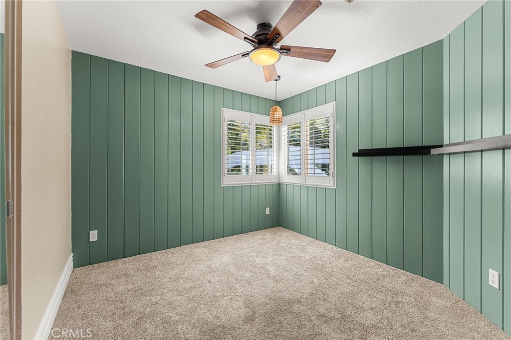 16825 Winterbrook Circle Riverside, CA 92503 - Photo 22 of 42 a view of a livingroom with a ceiling fan & cabinets
