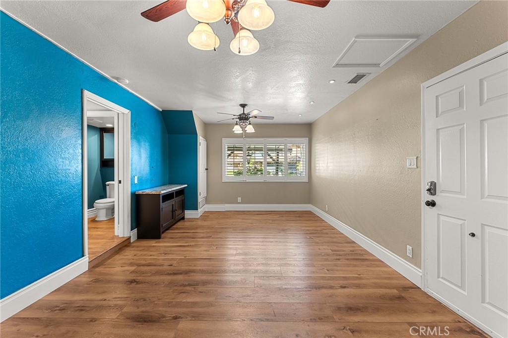 16825 Winterbrook Circle Riverside, CA 92503 - Photo 24 of 42 wooden floor in an empty room with a window