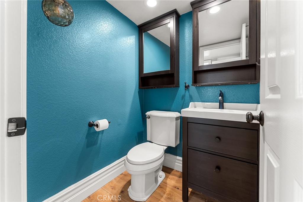 16825 Winterbrook Circle Riverside, CA 92503 - Photo 25 of 42 a bathroom with a toilet a sink and mirror