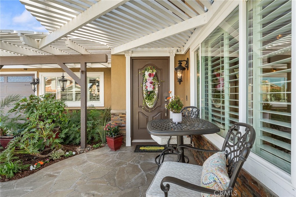 16825 Winterbrook Circle Riverside, CA 92503 - Photo 34 of 42 a view of a patio with table and chairs and potted plants