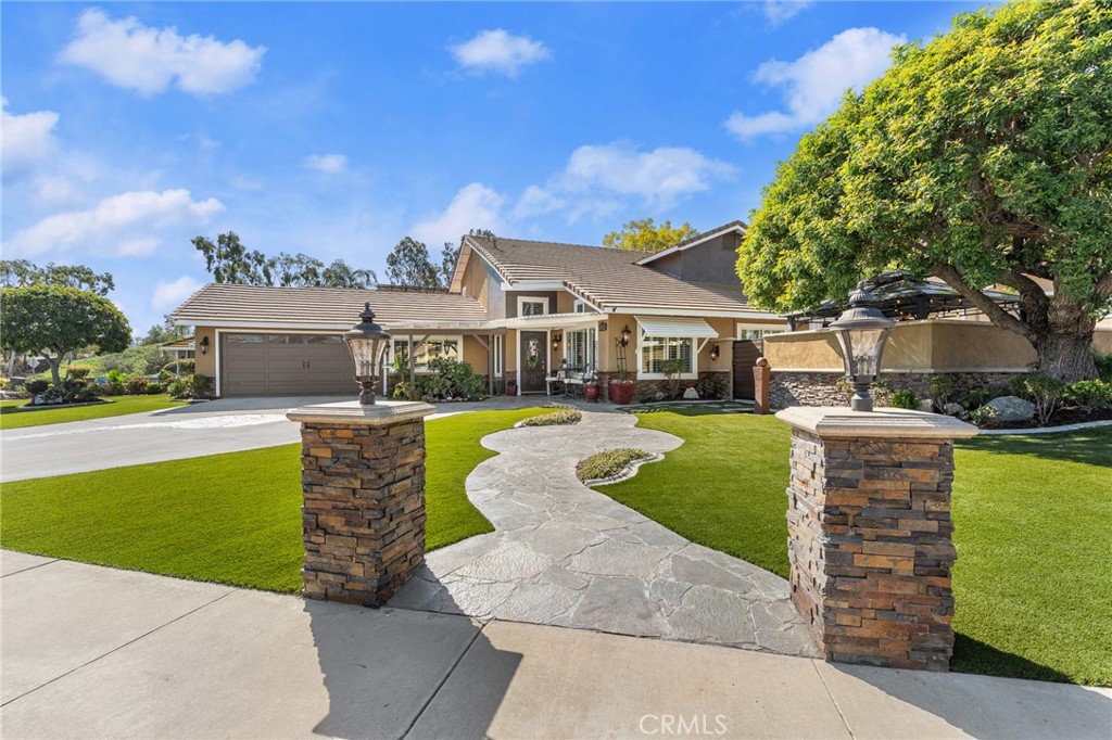 16825 Winterbrook Circle Riverside, CA 92503 - Photo 4 of 42 a front view of a house with a garden