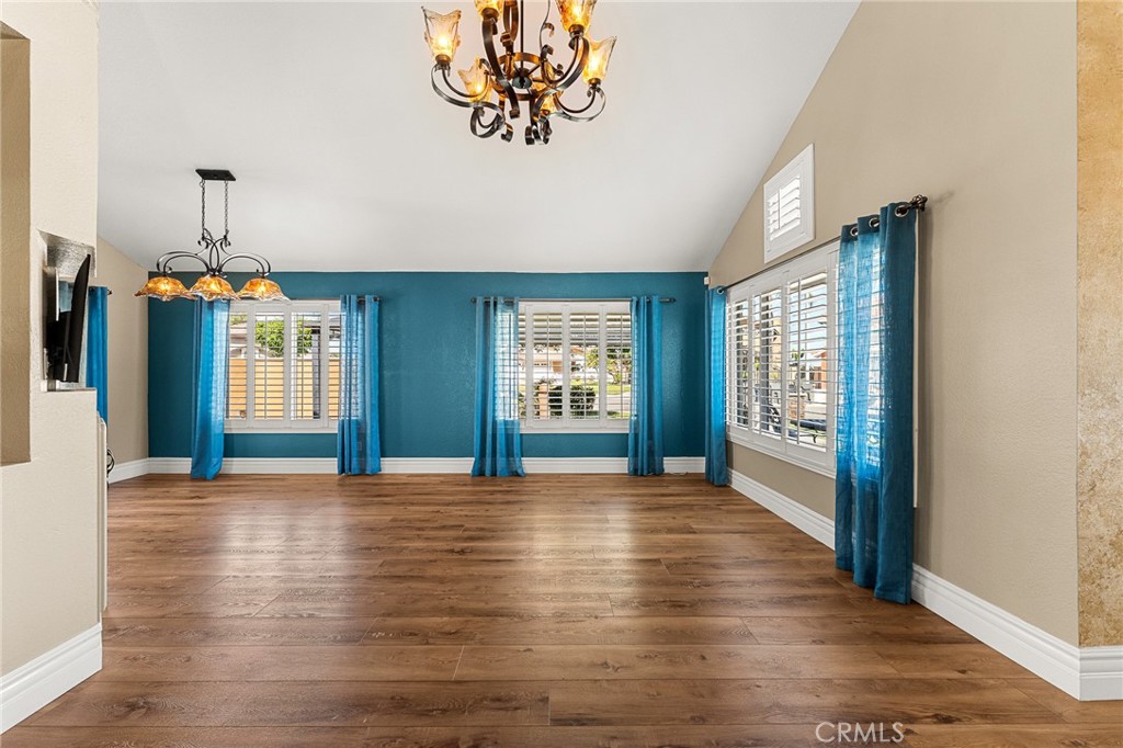 16825 Winterbrook Circle Riverside, CA 92503 - Photo 9 of 42 a view of an empty room with window and wooden floor
