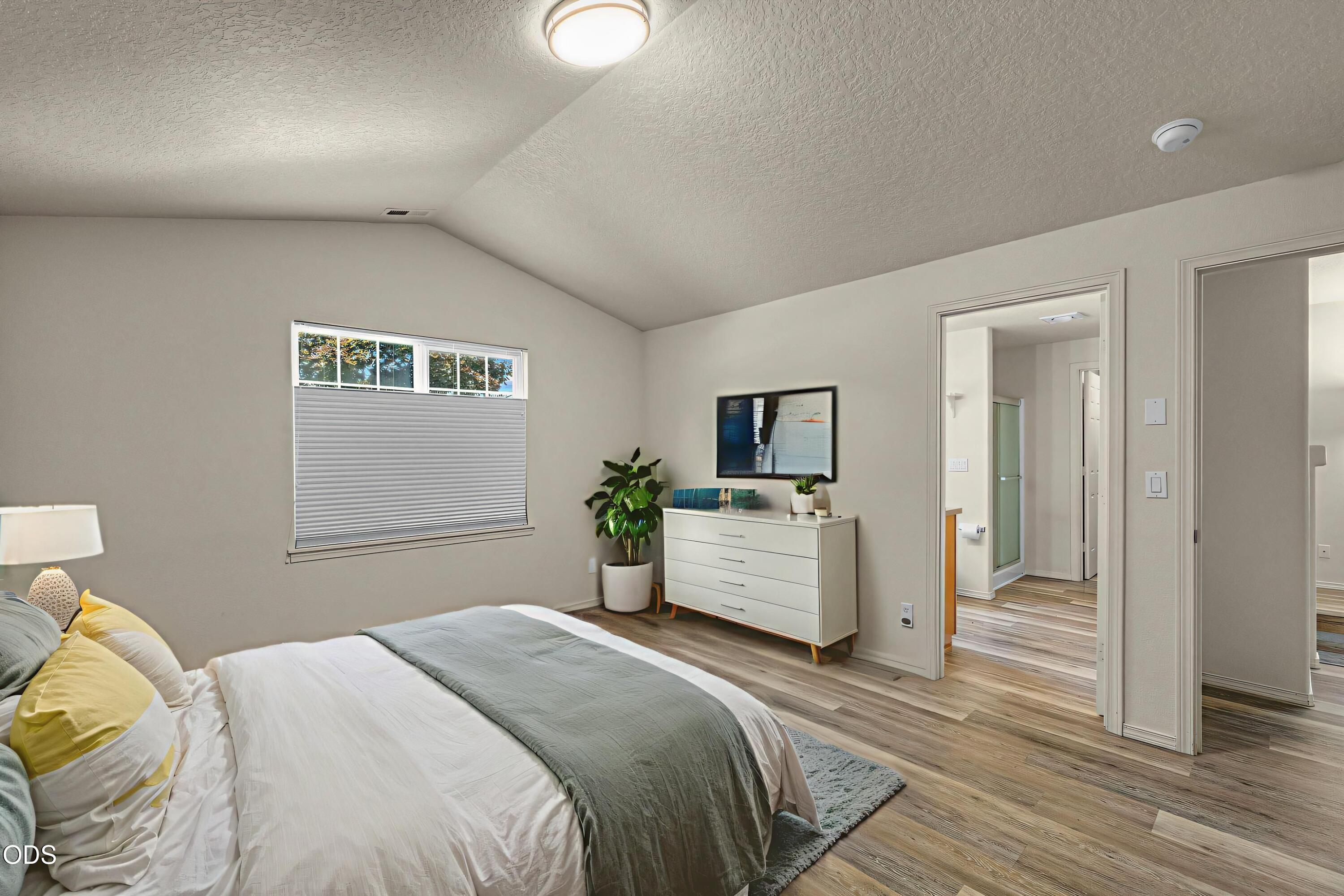 20535 Sunderland Way Bend, OR 97701 - Photo 21 of 41 a bedroom with a bed and a view
