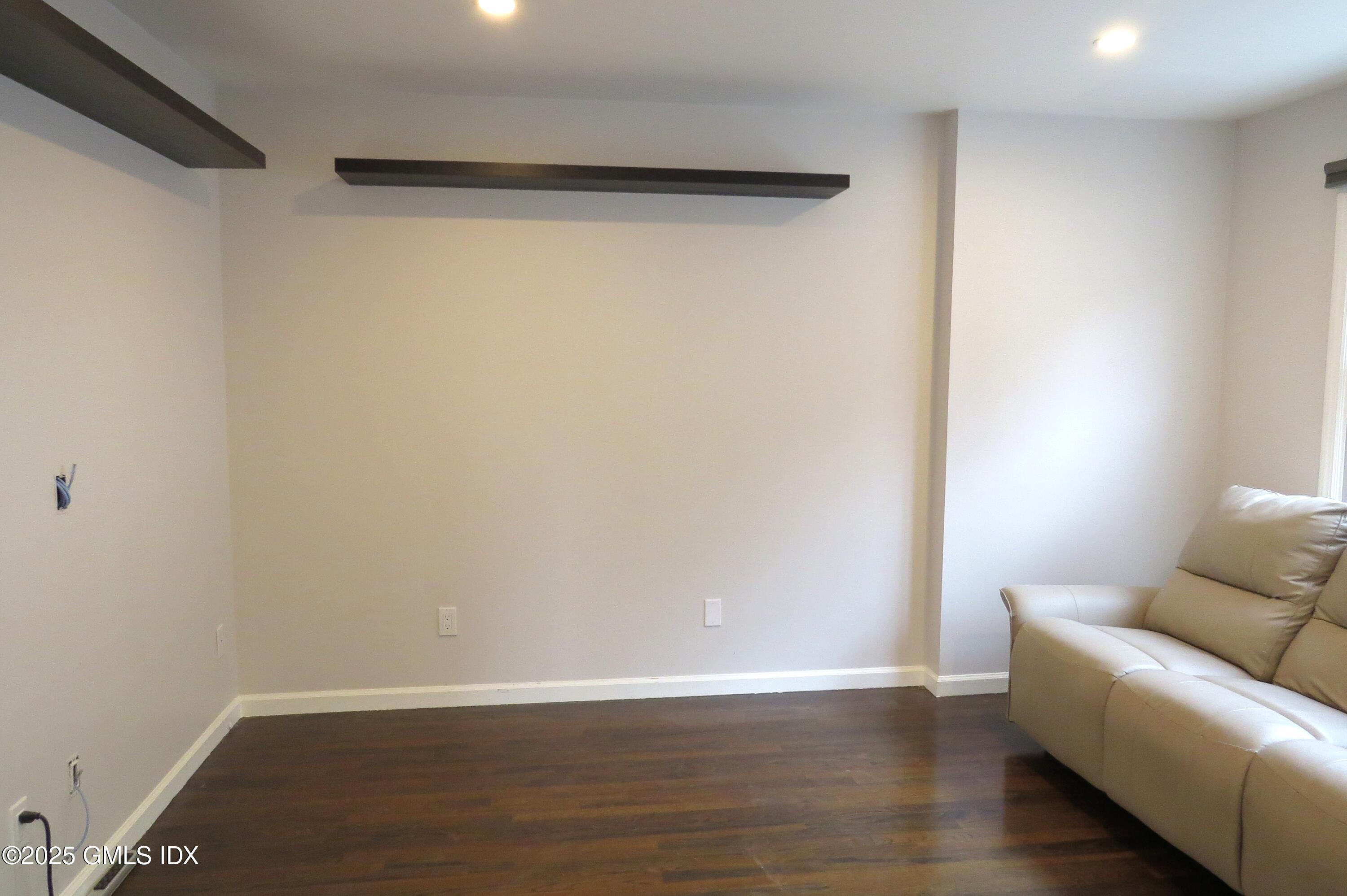68 Pemberwick Road, Unit 1 Greenwich, CT 06831 - Photo 6 of 18 a view of a livingroom with wooden floor