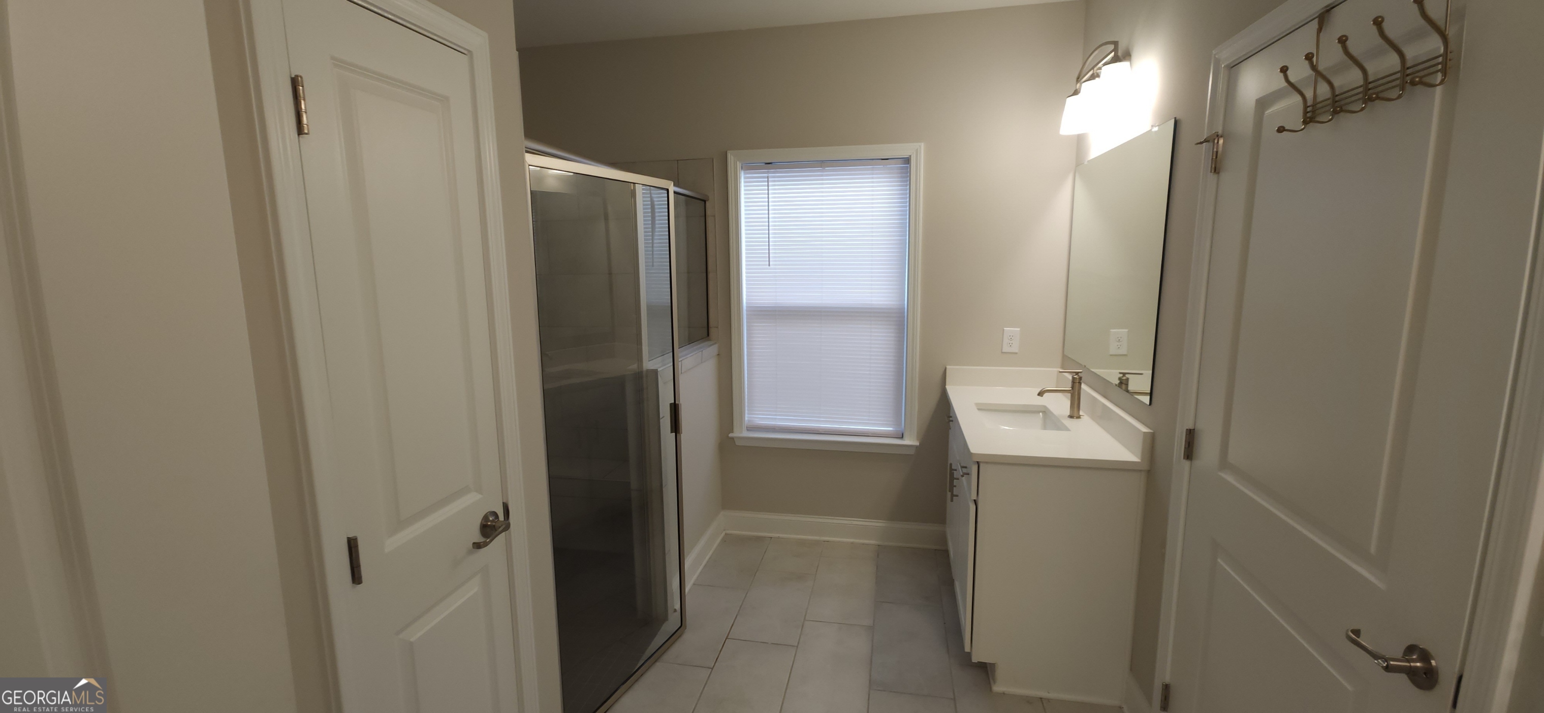 2606 Dorset Lane Grayson, GA 30017 - Photo 19 of 24 a bathroom with a shower and a sink