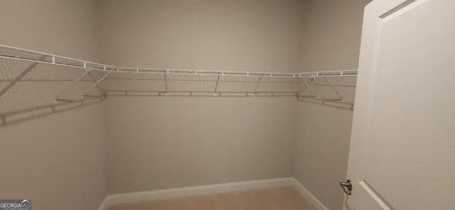 a bathroom with a glass shower door and a sink