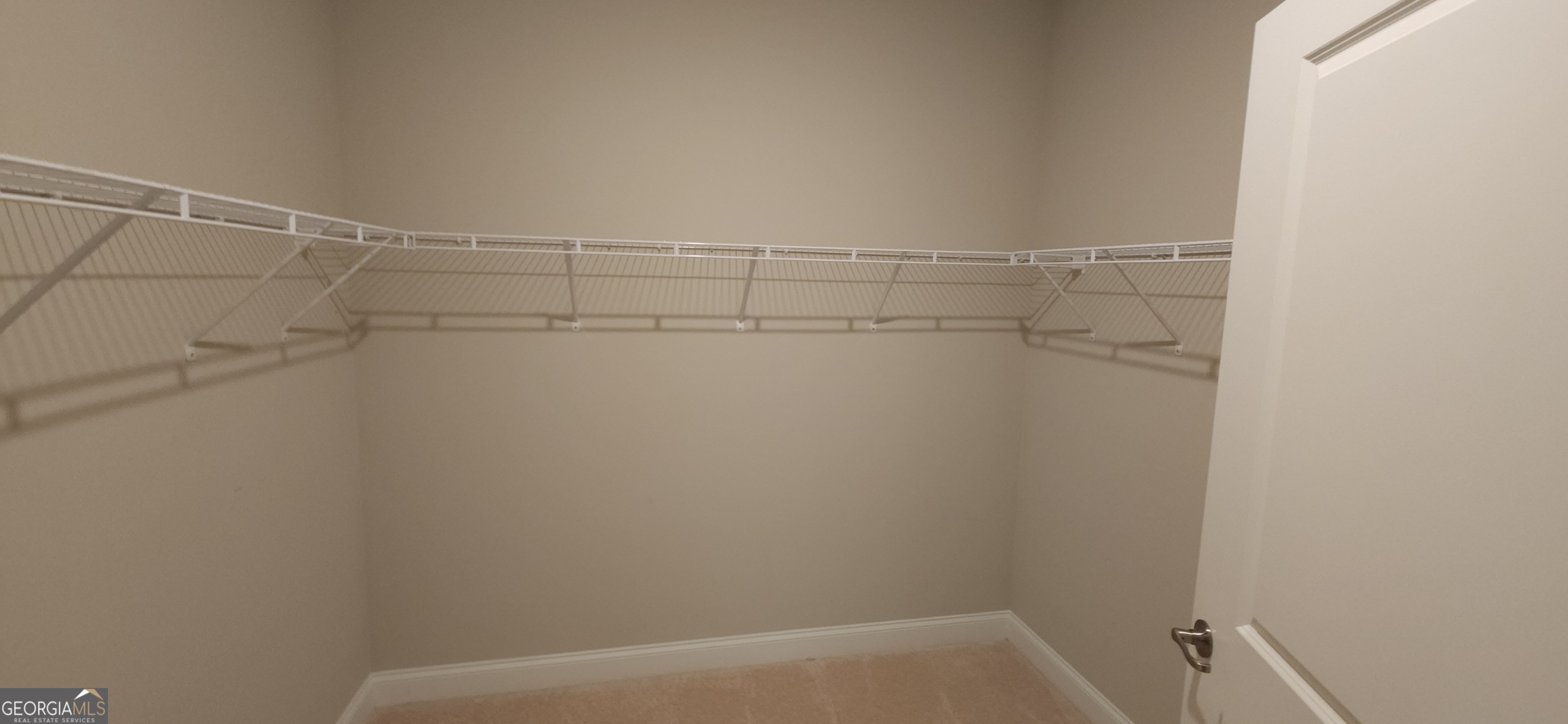 2606 Dorset Lane Grayson, GA 30017 - Photo 20 of 24 a view of a room with racks on the wall