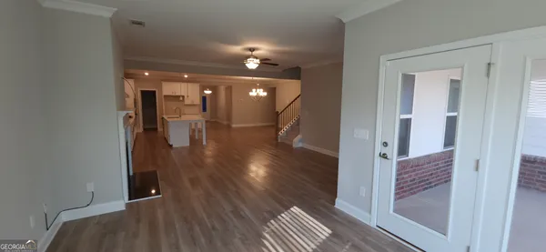 a view of gallery with wooden floor