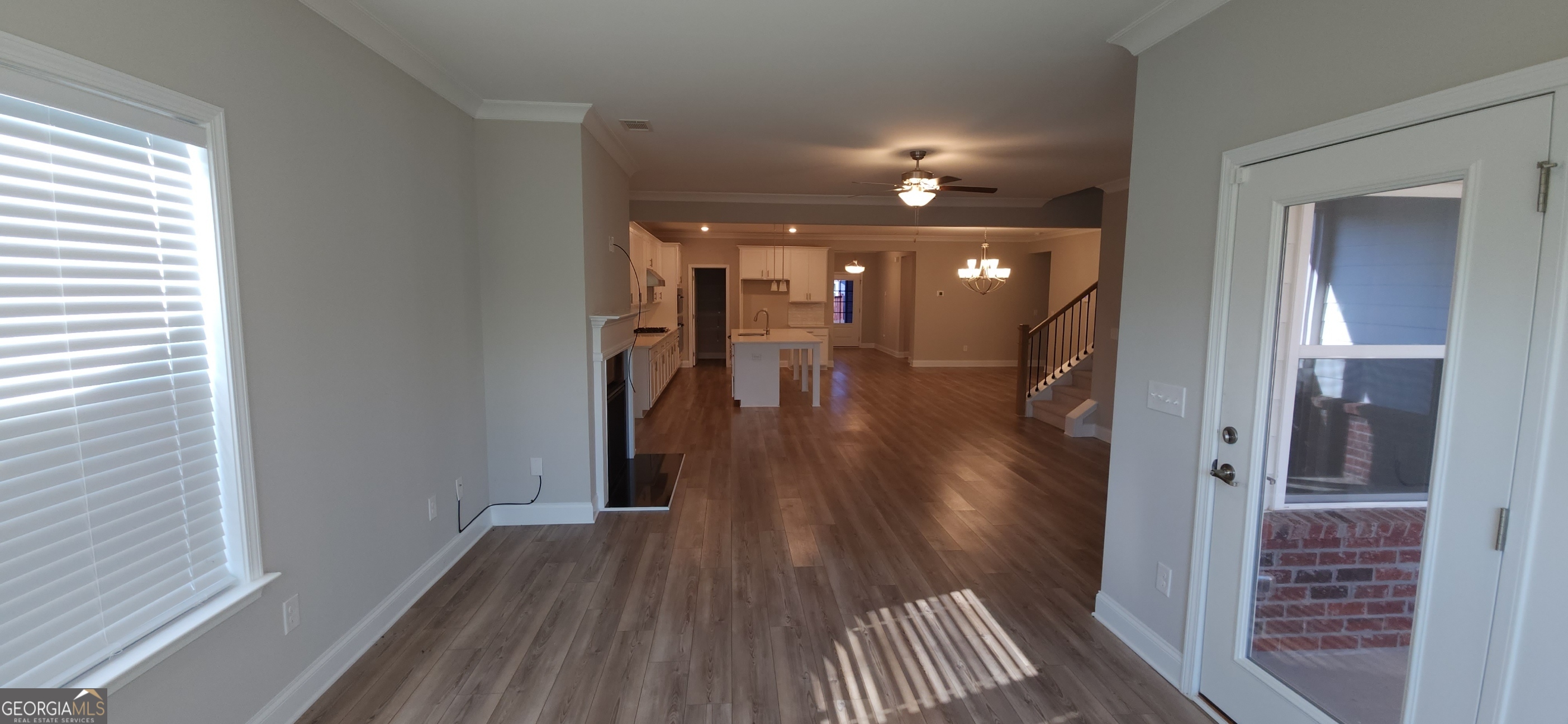 2606 Dorset Lane Grayson, GA 30017 - Photo 7 of 24 a view of a hallway with wooden floor and a bathroom