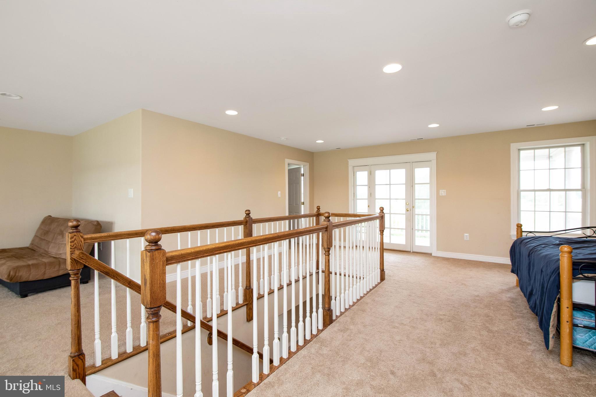 324 East Lake Road Pilesgrove, NJ 08098 - Photo 36 of 75 second story foyer/LR with balcony access