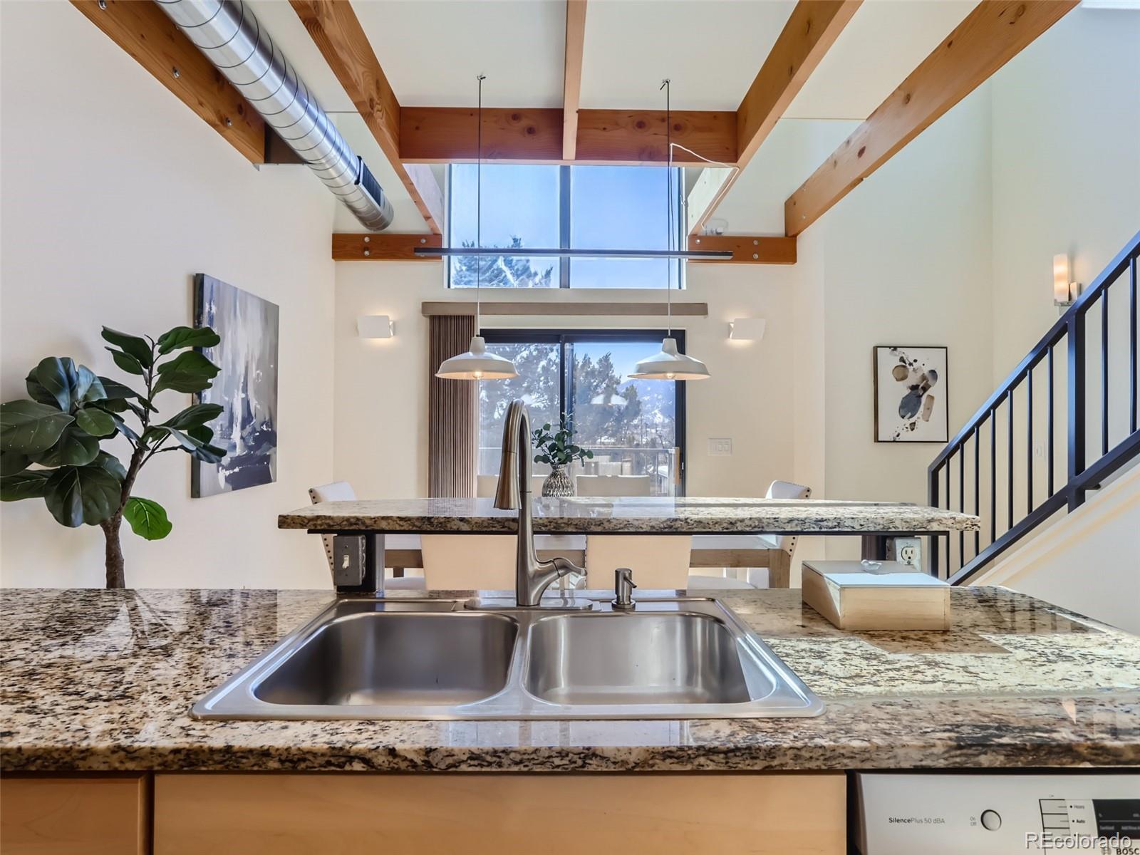 4645 Broadway, Unit B8 Boulder, CO 80304 - Photo 4 of 39 a kitchen with sink a granite counter top and a potted plant