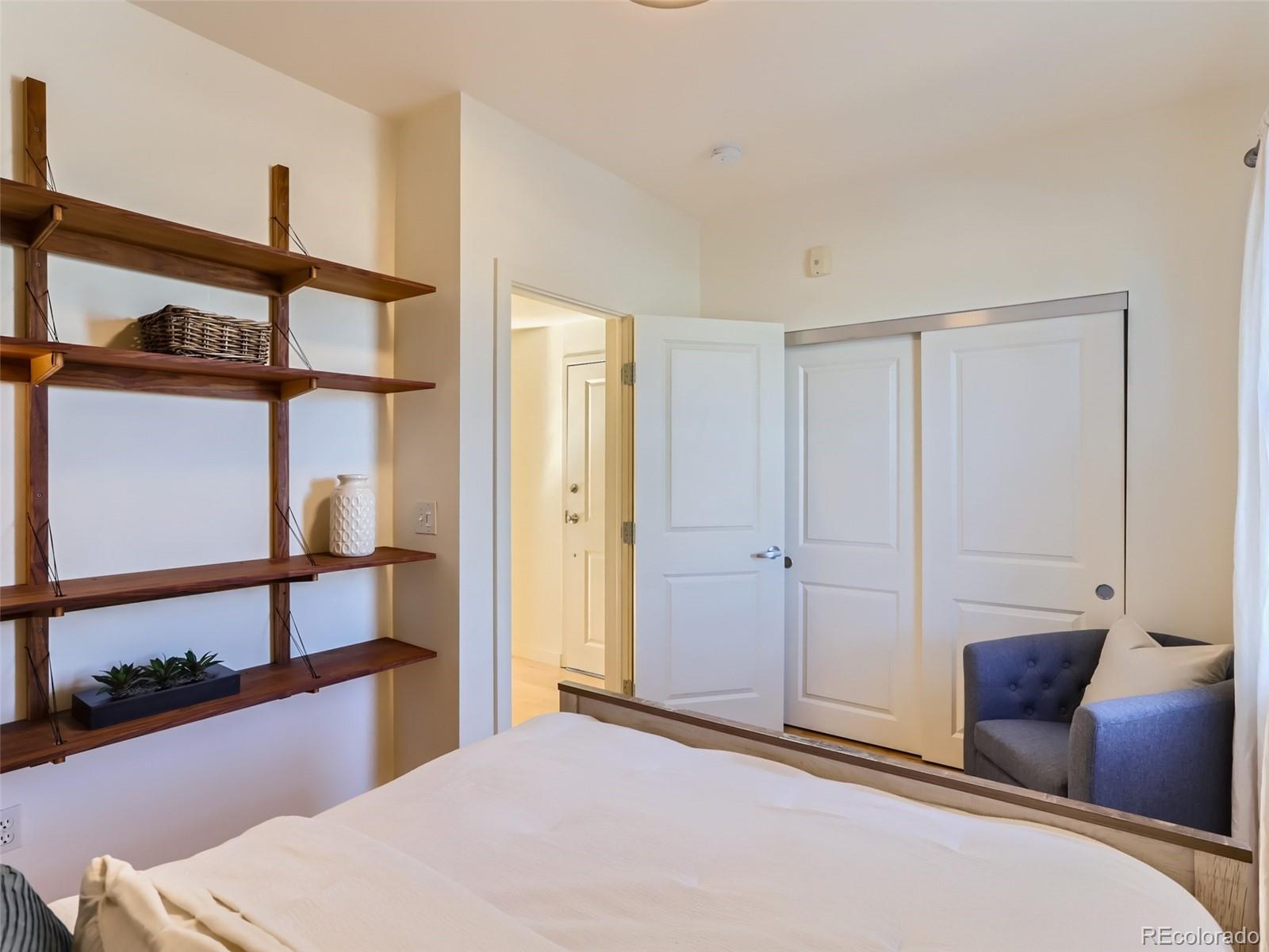 4645 Broadway, Unit B8 Boulder, CO 80304 - Photo 10 of 39 a bedroom with a bed and a window