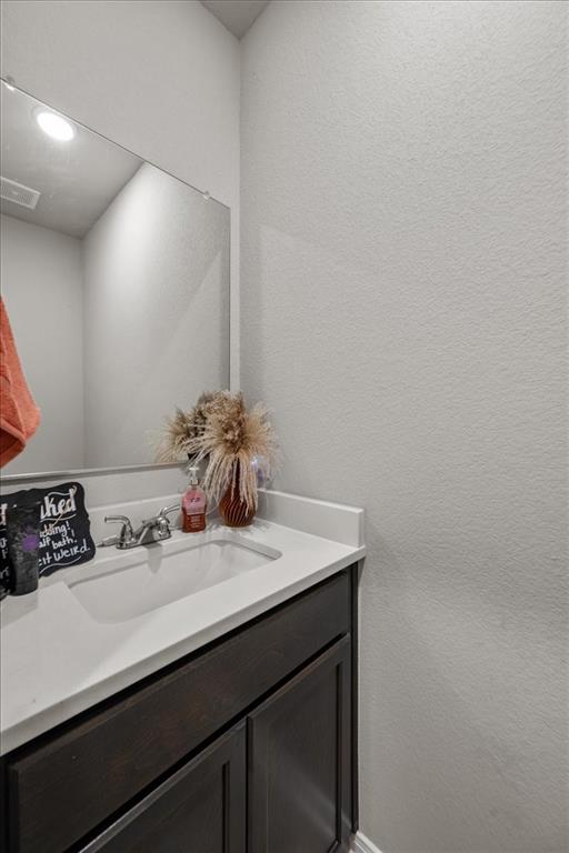 3501 Beutel Road Lorena, TX 76655 - Photo 17 of 33 Bathroom with a textured wall and vanity