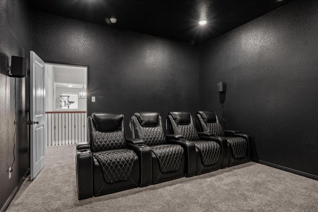 3501 Beutel Road Lorena, TX 76655 - Photo 23 of 33 Home theater room featuring carpet flooring and a textured wall