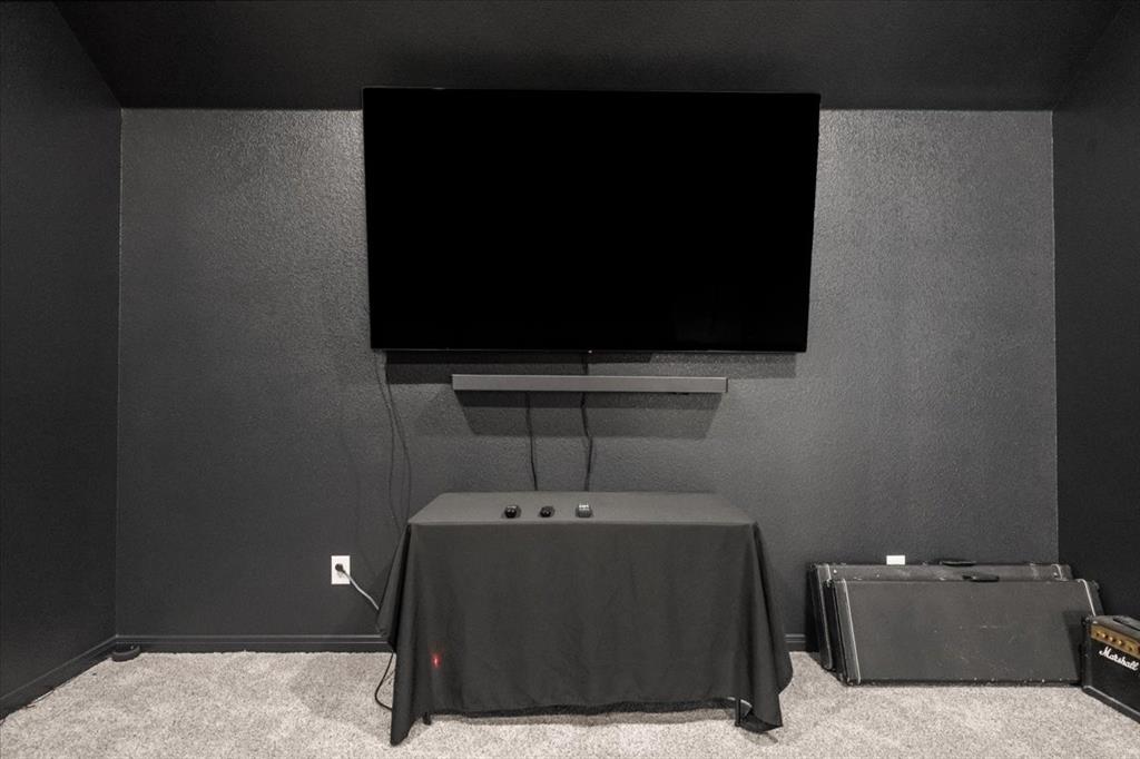 3501 Beutel Road Lorena, TX 76655 - Photo 24 of 33 Cinema featuring carpet flooring and a textured wall