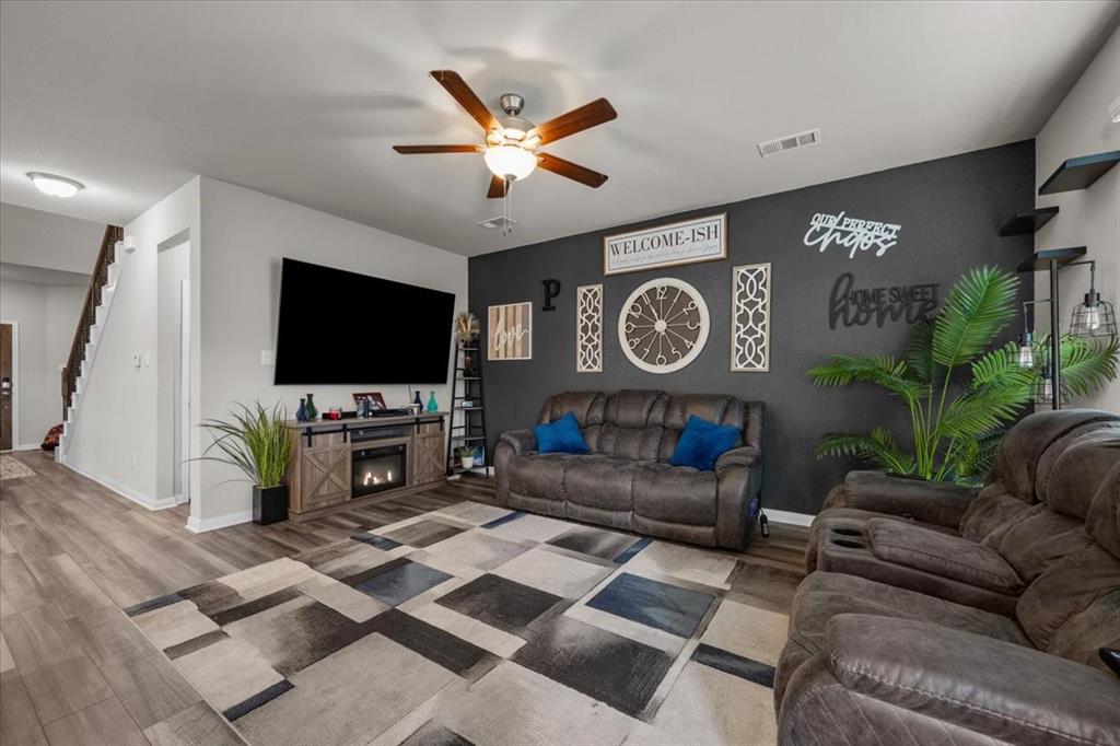 3501 Beutel Road Lorena, TX 76655 - Photo 10 of 33 Living area with stairway, wood finished floors, and ceiling fan