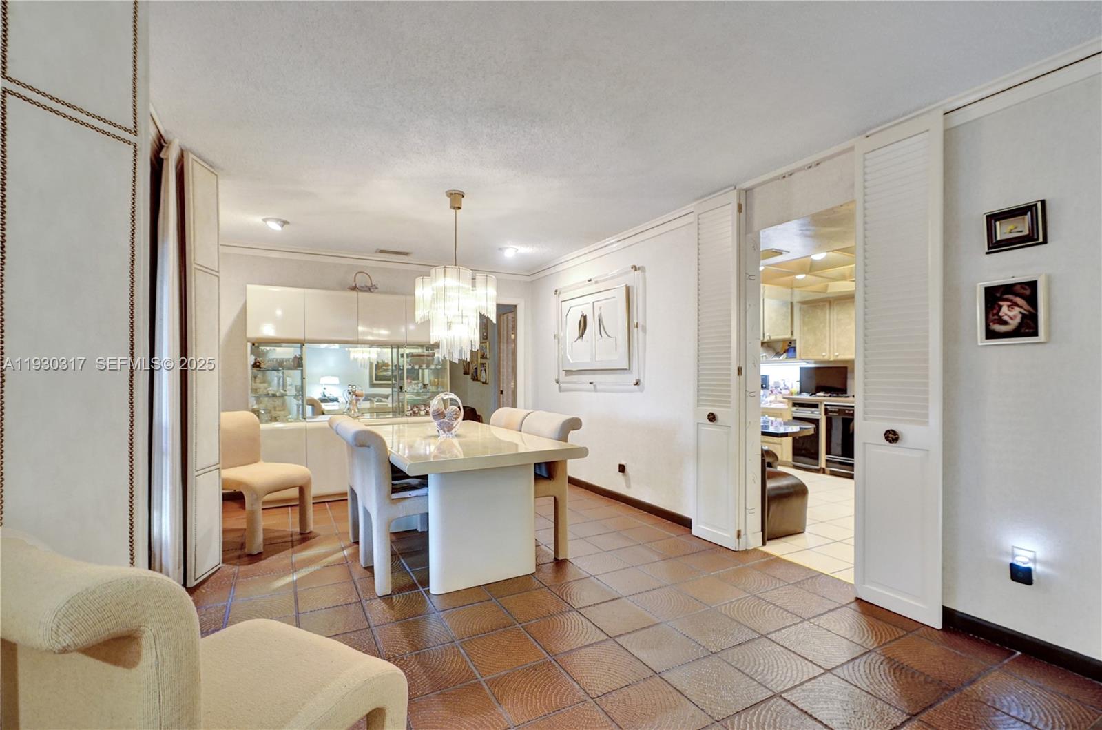 8115 Southwest 92nd Court Miami, FL 33173 - Photo 11 of 42 a living room with furniture a dining table and chairs
