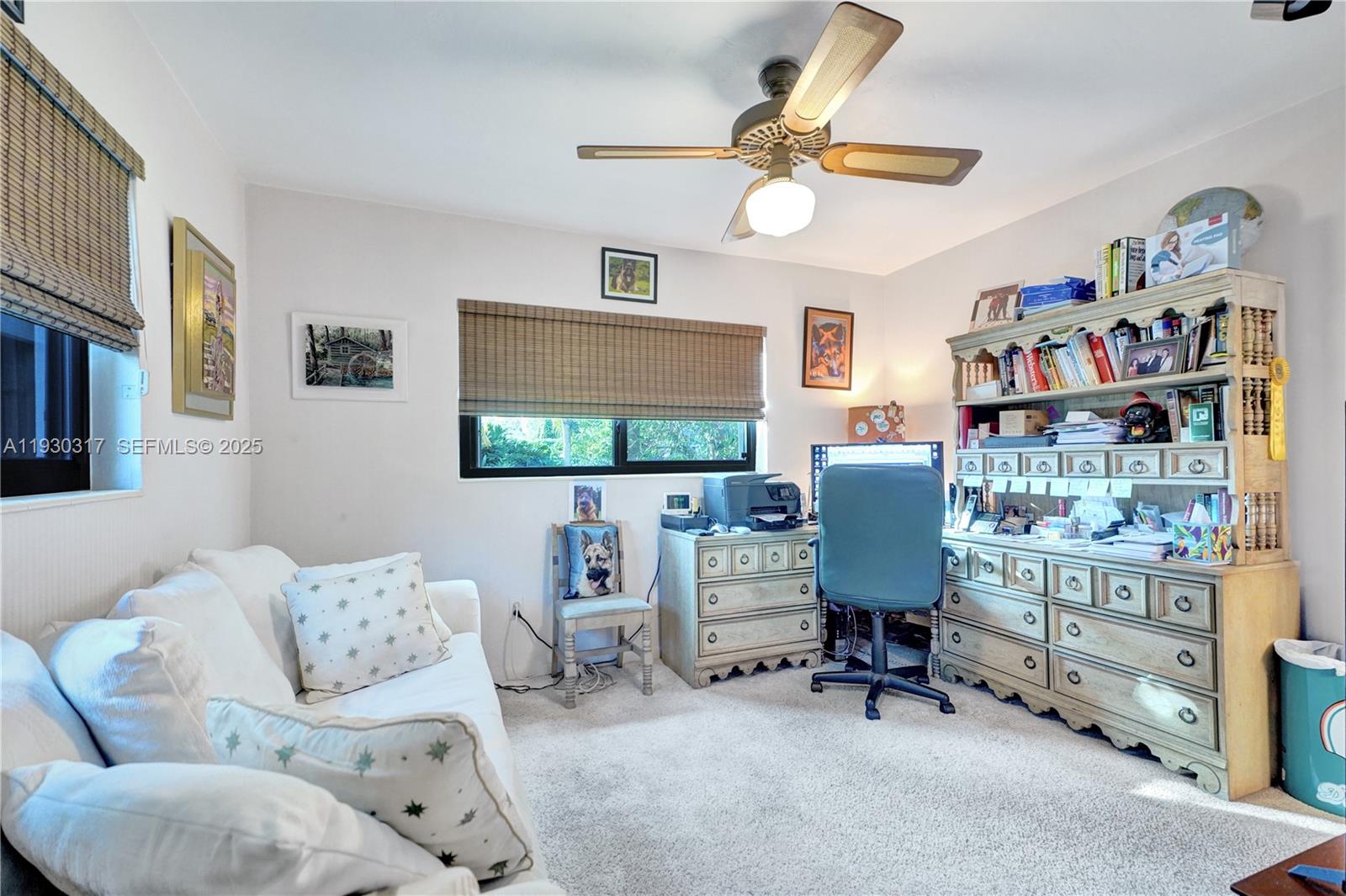 8115 Southwest 92nd Court Miami, FL 33173 - Photo 12 of 42 a living room with furniture and a flat screen tv