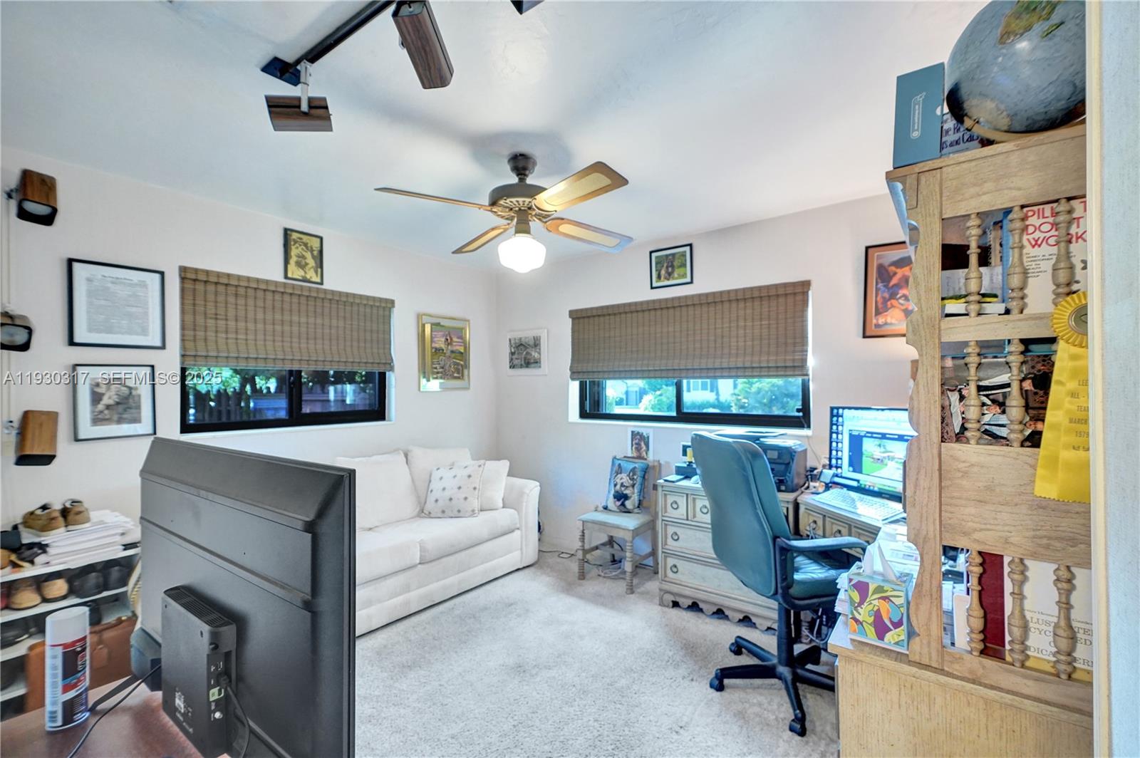 8115 Southwest 92nd Court Miami, FL 33173 - Photo 13 of 42 a living room with furniture and a flat screen tv