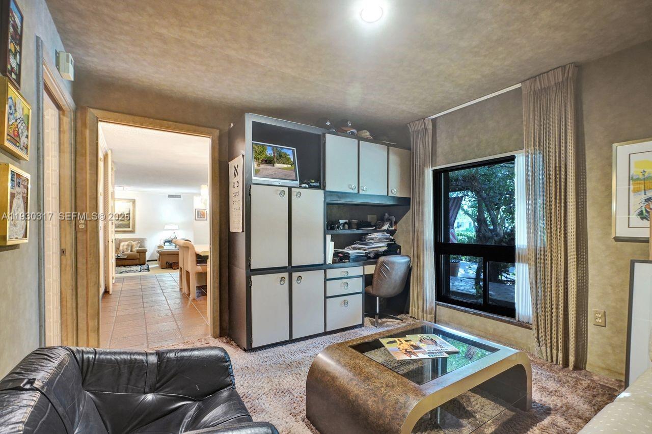 8115 Southwest 92nd Court Miami, FL 33173 - Photo 14 of 42 a living room with furniture and a table