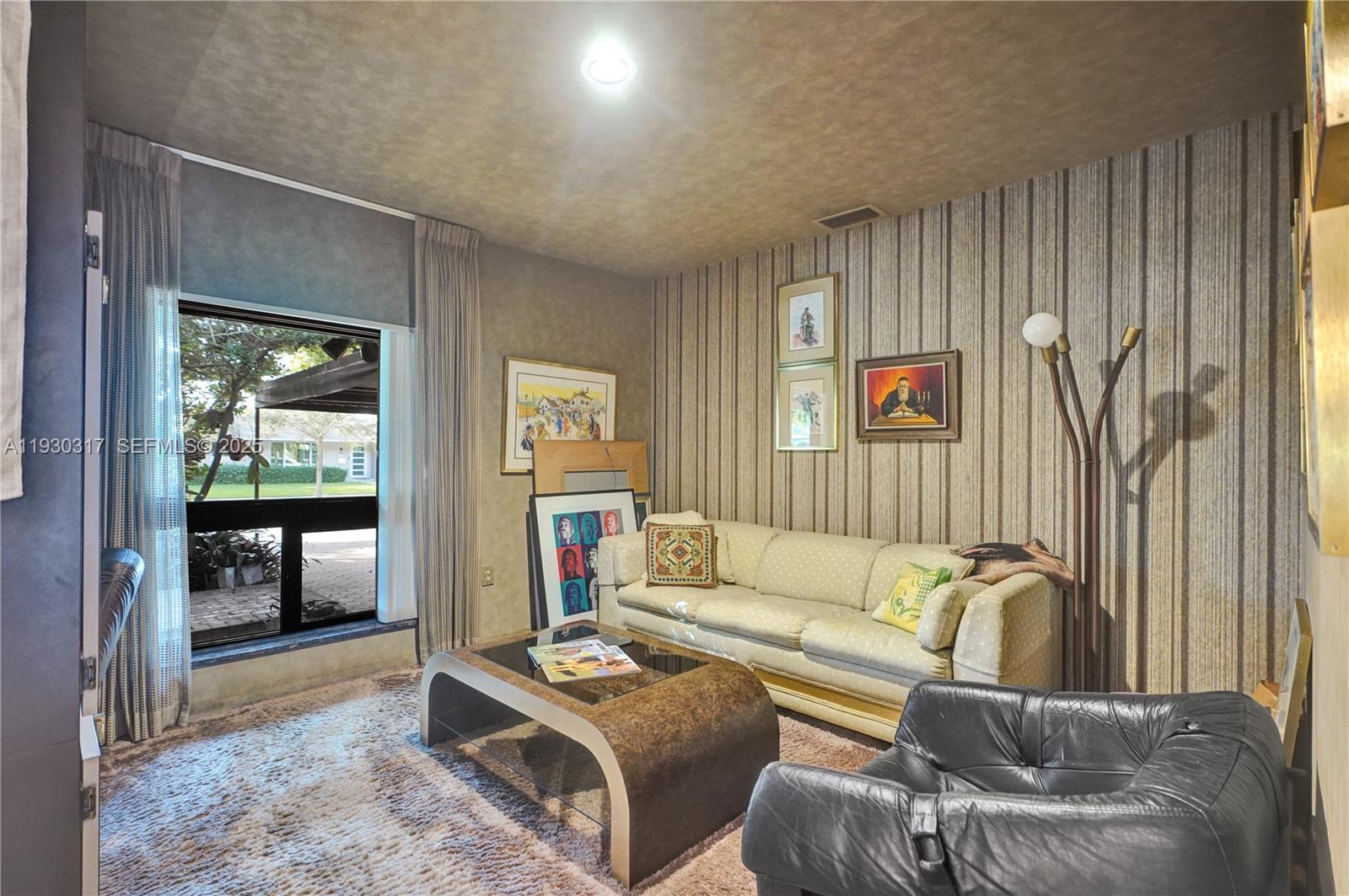 8115 Southwest 92nd Court Miami, FL 33173 - Photo 19 of 42 a living room with furniture and a window