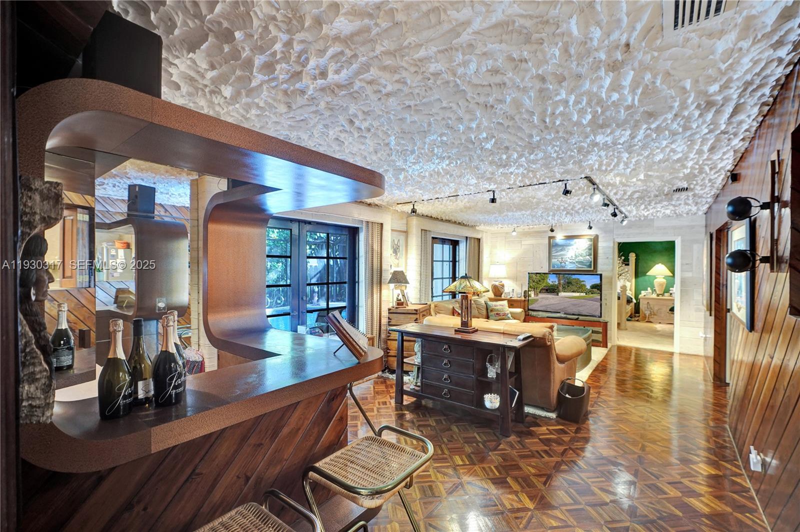 8115 Southwest 92nd Court Miami, FL 33173 - Photo 25 of 42 a living room with lots of furniture and wooden floor