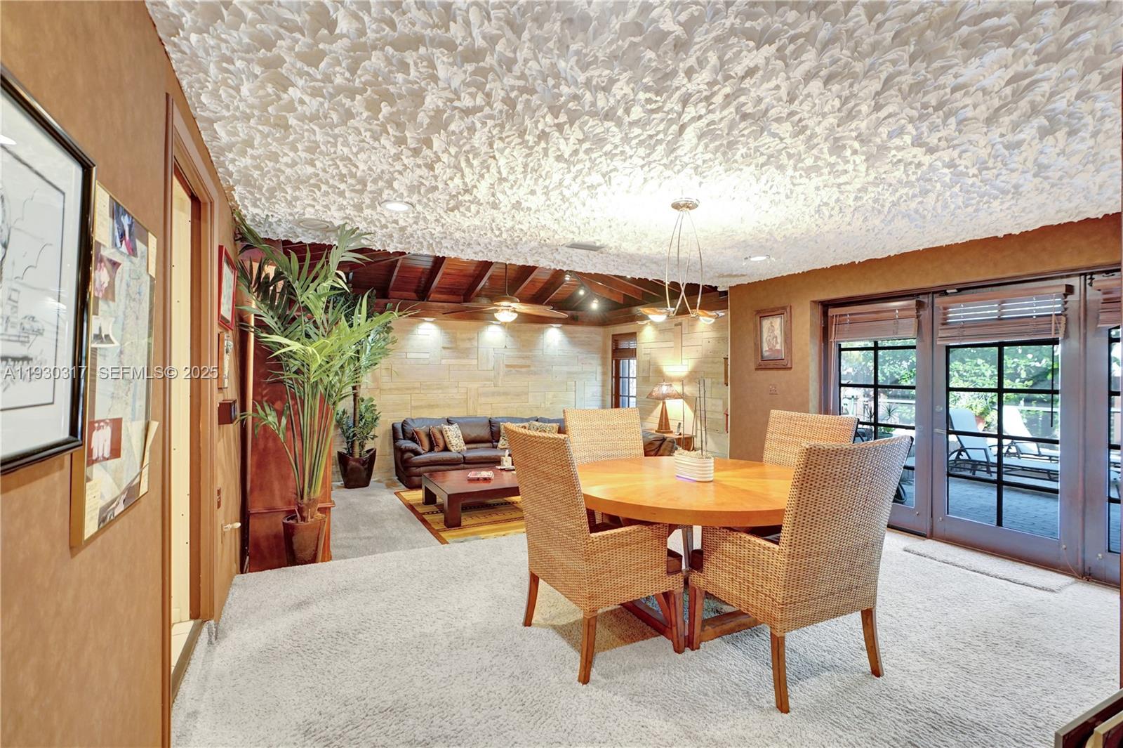 8115 Southwest 92nd Court Miami, FL 33173 - Photo 26 of 42 a dining room with furniture and a floor to ceiling window