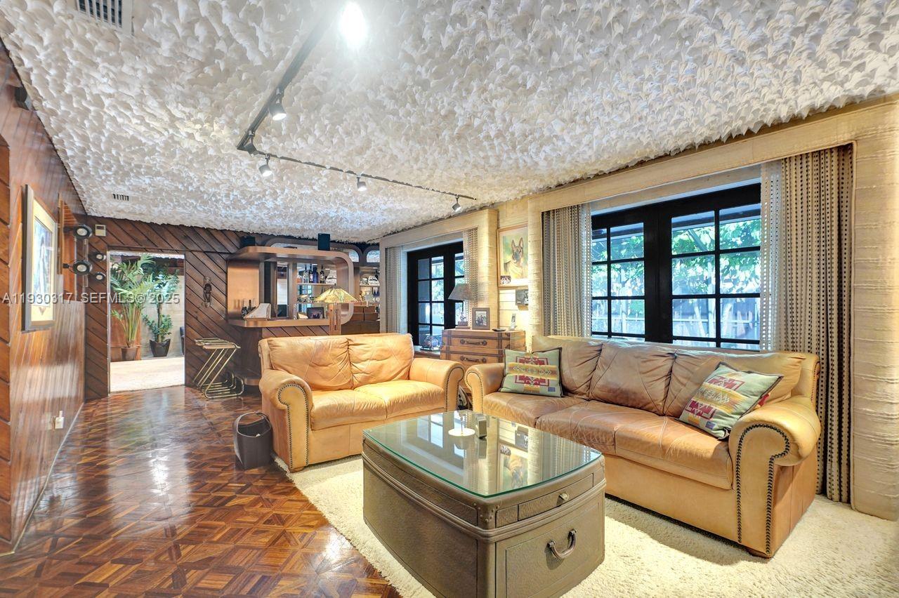 8115 Southwest 92nd Court Miami, FL 33173 - Photo 29 of 42 a living room with furniture and a large window