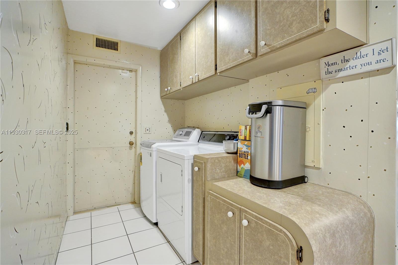 8115 Southwest 92nd Court Miami, FL 33173 - Photo 32 of 42 a utility room with dryer and washer
