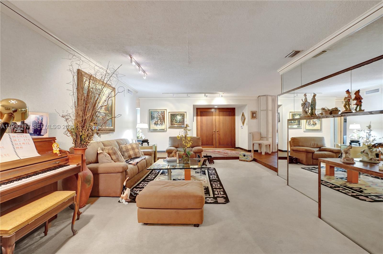 8115 Southwest 92nd Court Miami, FL 33173 - Photo 6 of 42 a living room with furniture and a window