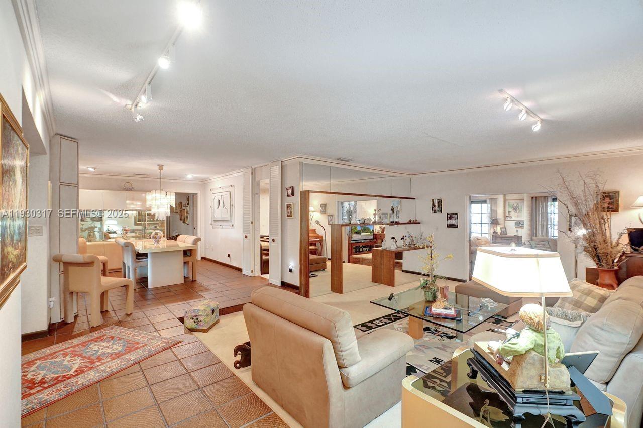 8115 Southwest 92nd Court Miami, FL 33173 - Photo 7 of 42 a living room with furniture and a table
