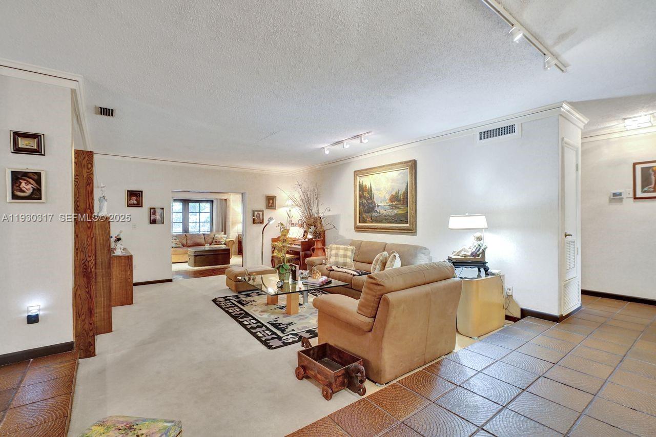 8115 Southwest 92nd Court Miami, FL 33173 - Photo 8 of 42 a living room with furniture