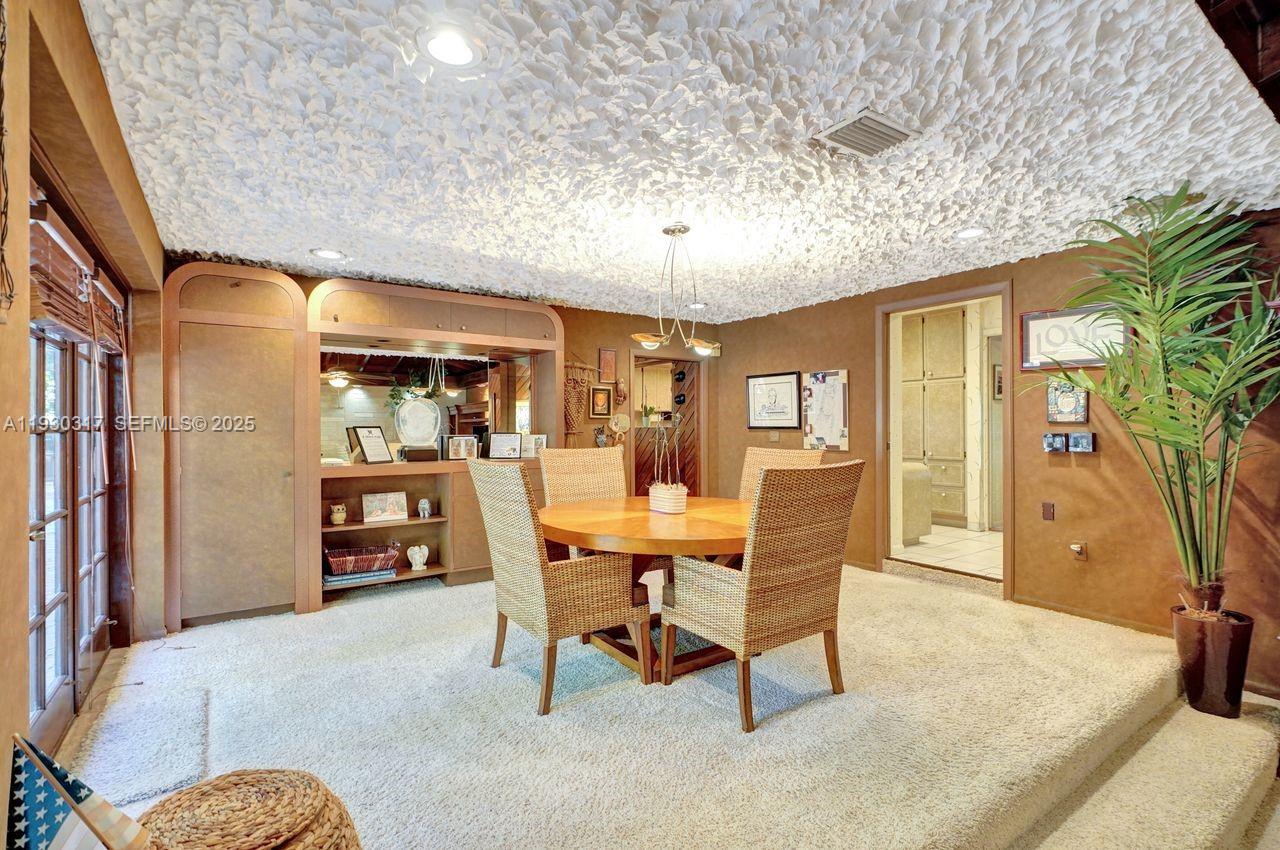 8115 Southwest 92nd Court Miami, FL 33173 - Photo 9 of 42 a dining room with furniture and window