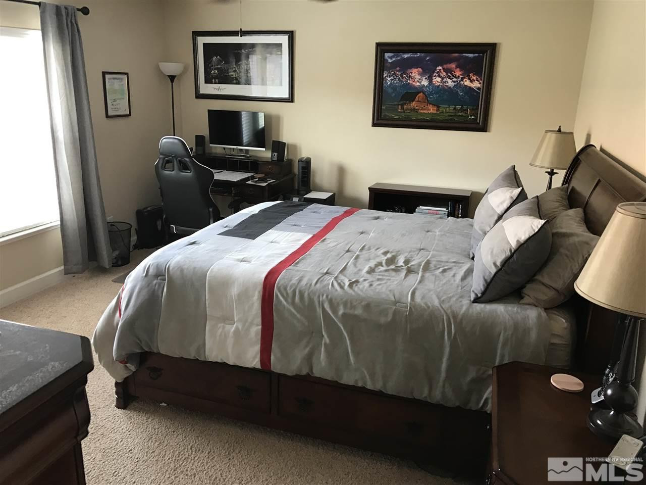 2055 Black Sand Drive Reno, NV 89521 - Photo 13 of 17 a bedroom with a bed and wooden floor
