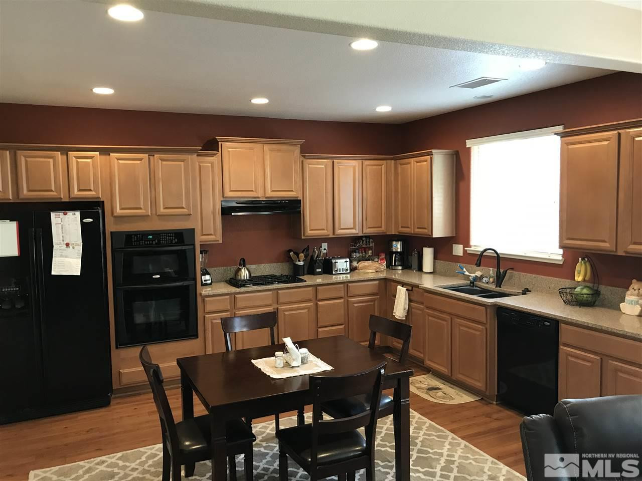 2055 Black Sand Drive Reno, NV 89521 - Photo 3 of 17 a kitchen with a sink stove and refrigerator
