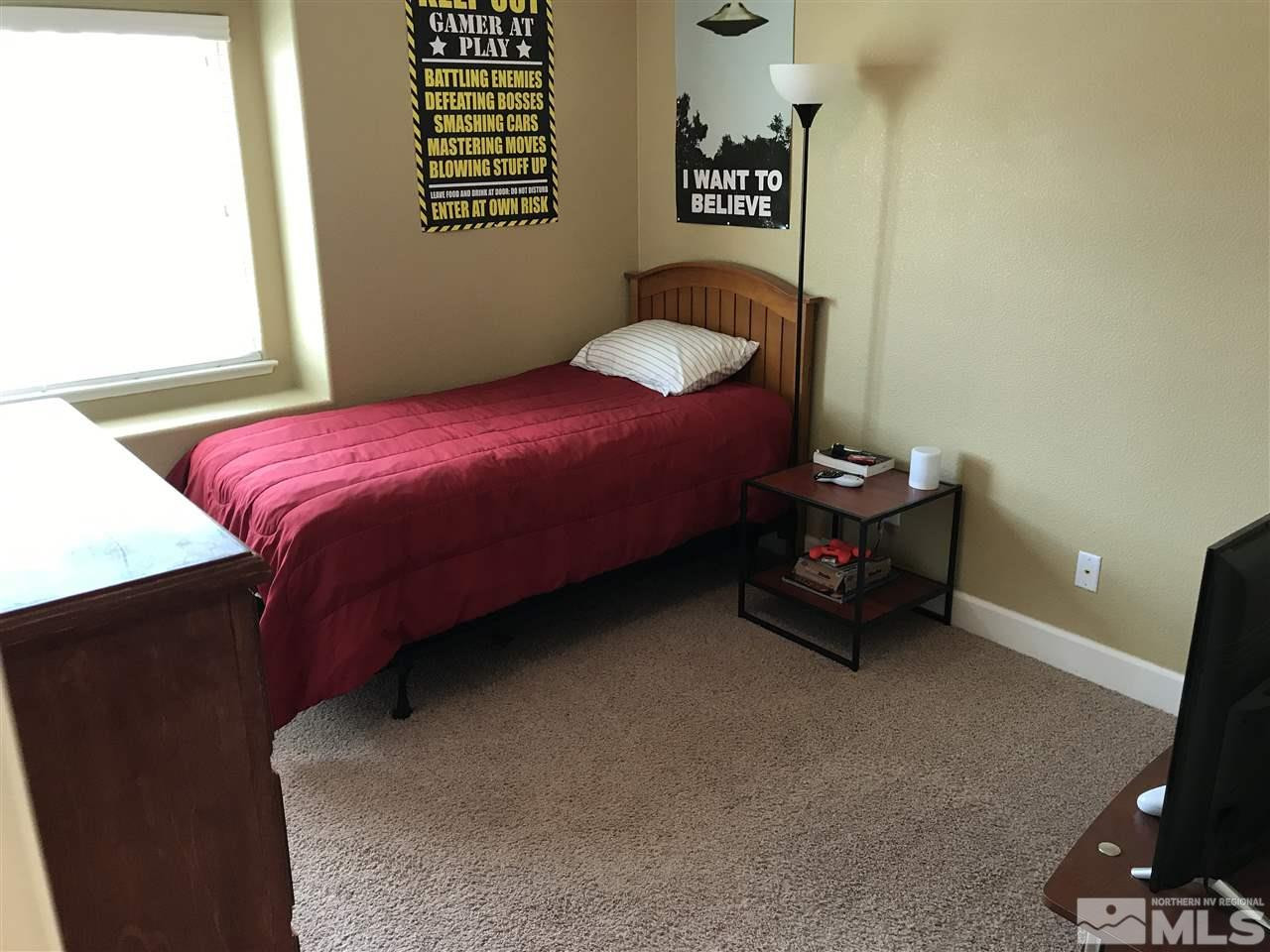 2055 Black Sand Drive Reno, NV 89521 - Photo 10 of 17 a bedroom with a bed and a window