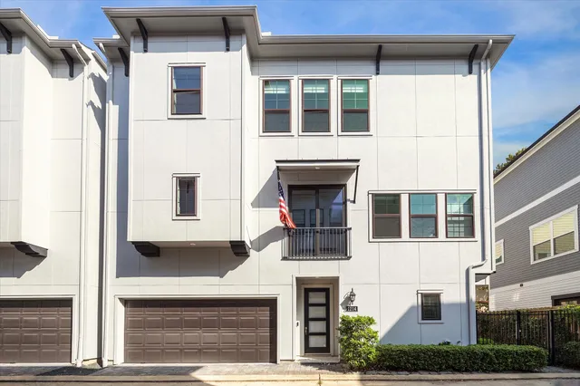 a front view of a house with a garage