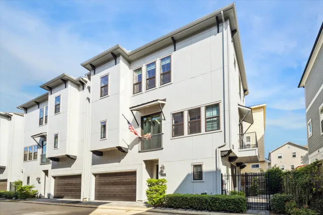 a view of a white building among the street