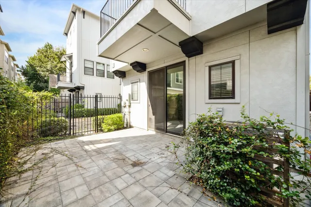 a view of a house with backyard and a patio