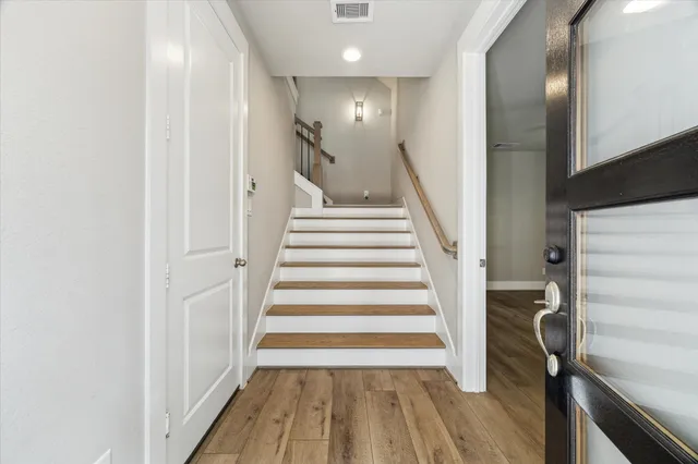 a view of entryway with wooden floor
